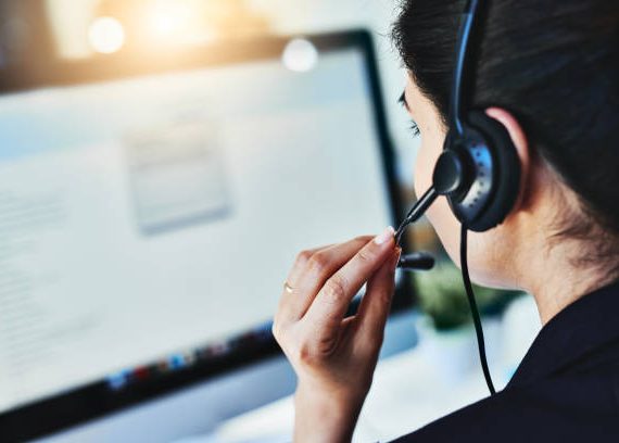 Rearview shot of a young woman working in a call centre